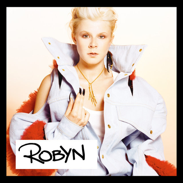 Album cover featuring Robyn wearing a light denim jacket with red frilled sleeves.