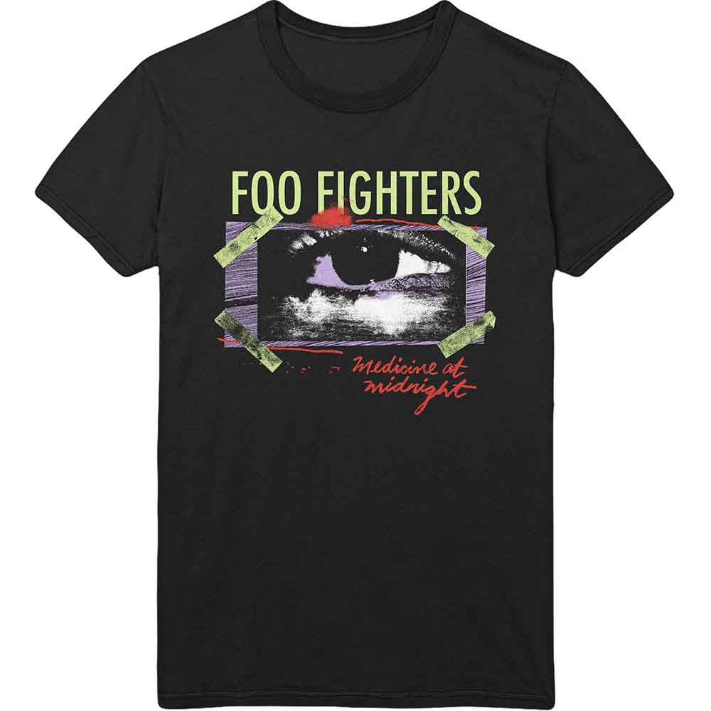 A man wearing a black Foo Fighters Medicine at Midnight t-shirt with eye graphic.