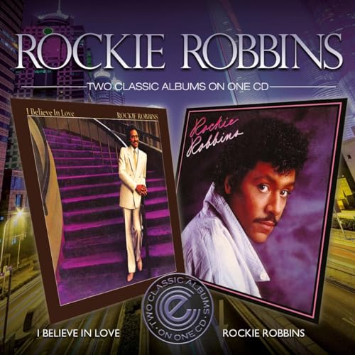 CD cover featuring two Rockie Robbins album artworks against a purple city background.