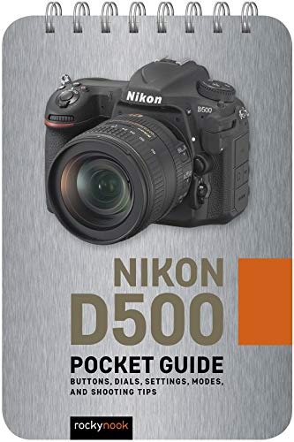 Nikon D500 camera on a spiral-bound pocket guide cover.