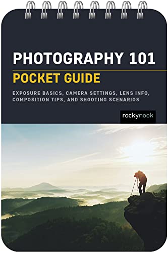 Spiral-bound Photography 101 pocket guide featuring a photographer on a cliff at sunrise.