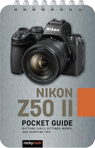 Nikon Z50 II camera on a spiral-bound pocket guide cover.