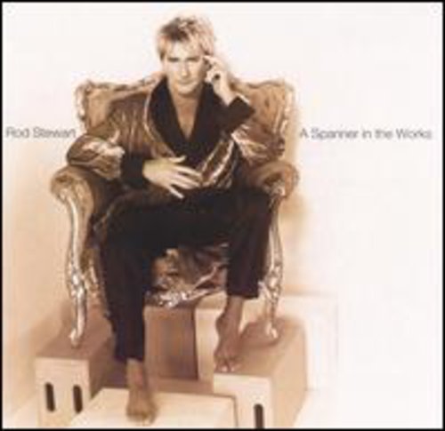 Rod Stewart album cover: man in a robe seated on ornate furniture.