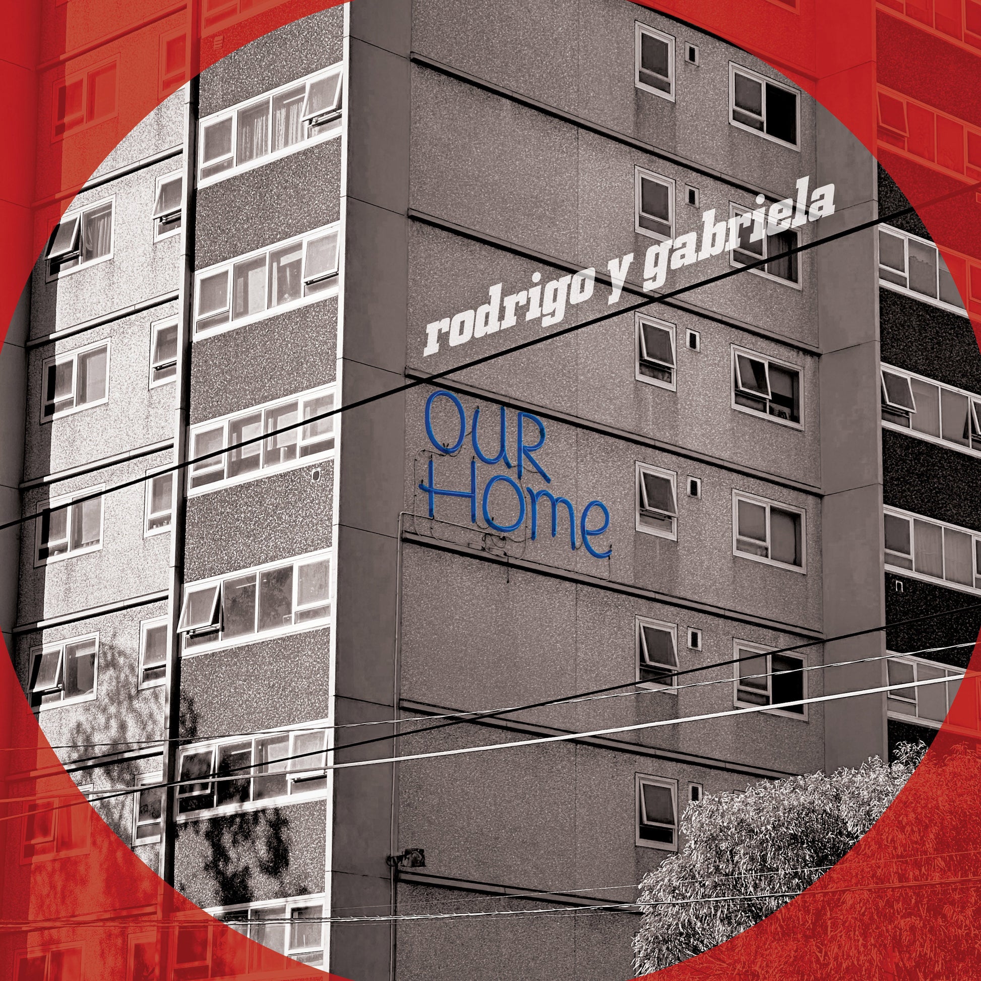 CD cover for Rodrigo y Gabriela’s “OurHome” featuring a building facade.