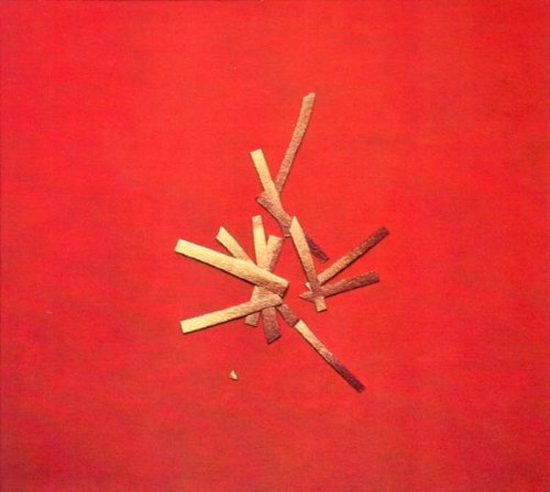Red album cover with scattered wooden sticks and a black circular label.