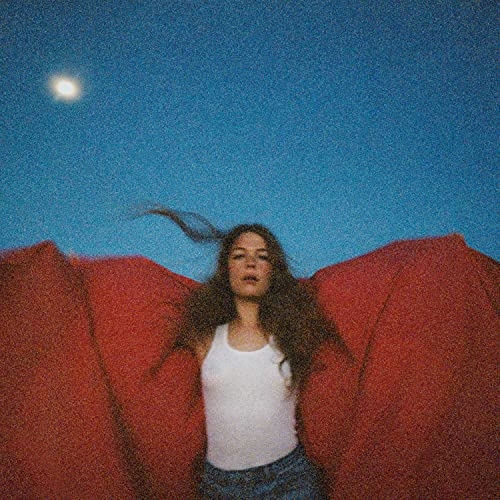 Maggie Rogers album cover: woman lying on red fabric under a moon.