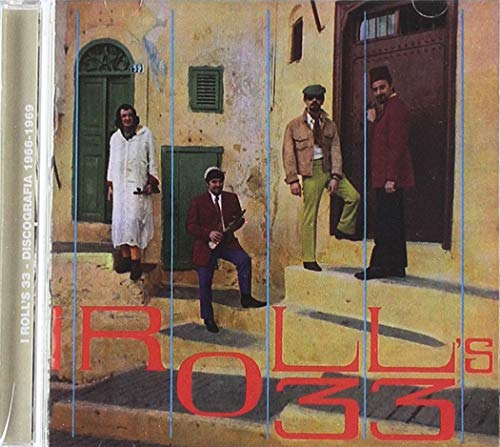CD case featuring four men in suits posing in front of a building.