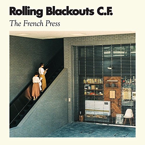 CD cover for Rolling Blackouts C.F.’s “The French Press” with a street scene.