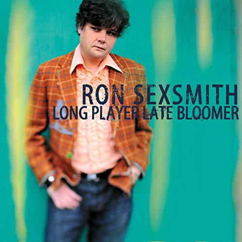 Ron Sexsmith album cover: man in plaid jacket, teal background.
