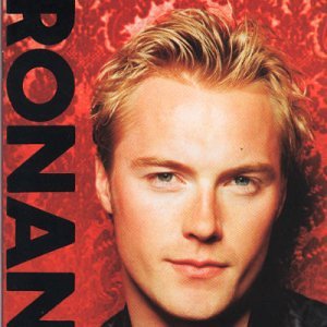 Close-up portrait of blonde Ronan Keating against a red patterned background with black text.
