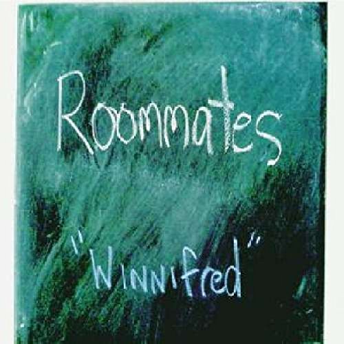 "Green chalkboard with 'Roommates' and 'Winnifred' written in white chalk."