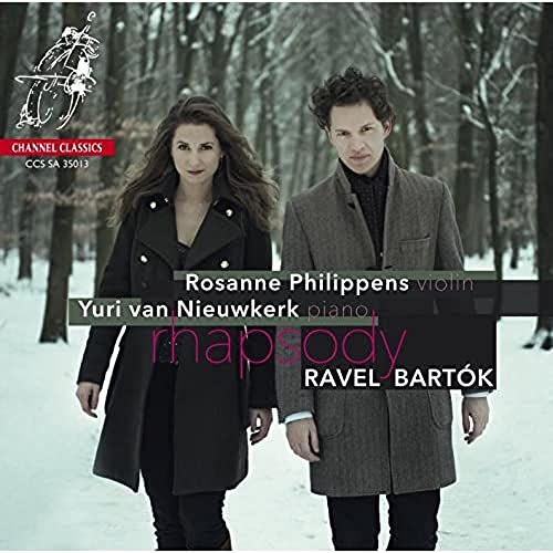 Two people in winter coats walking in a snowy forest, CD cover text overlay.