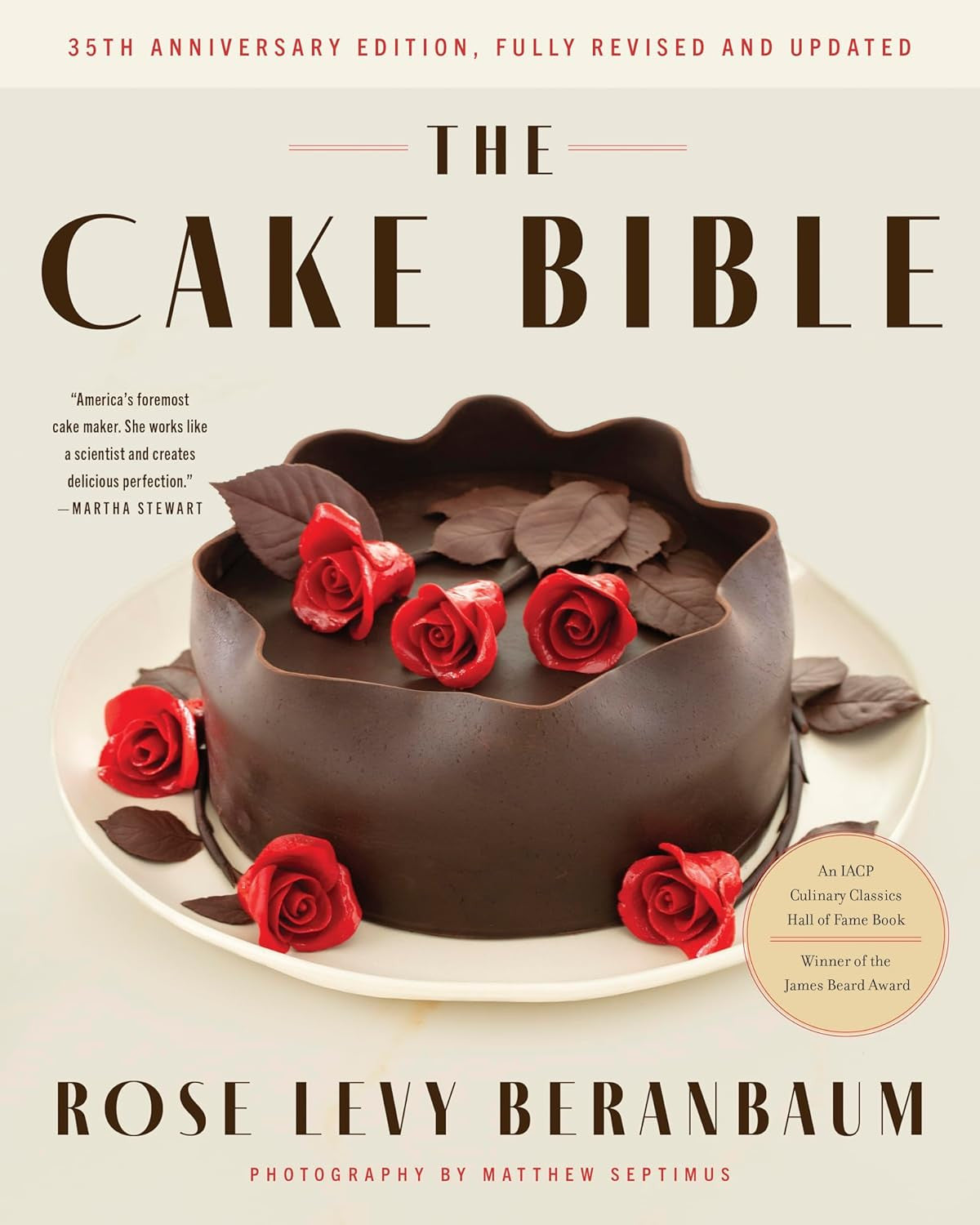 Cover of "The Cake Bible," featuring a chocolate cake decorated with roses.