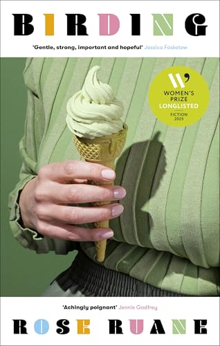 A person in a green sweater holds a green soft-serve ice cream cone.