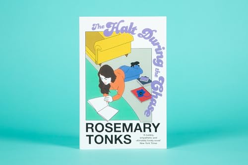 Book cover: woman writing on floor, sofa in background, title "The Halt During the Chase".