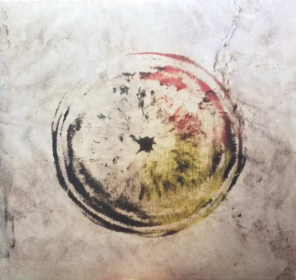 An abstract watercolor painting of a circular, apple-like shape on a wrinkled white background.