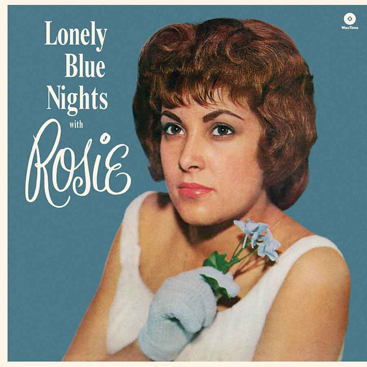 Album cover featuring a woman in a white top holding blue flowers.