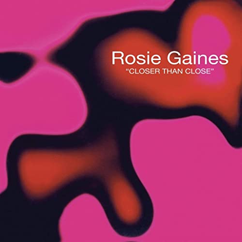 Vinyl cover with pink background and abstract orange and black fluid shapes.