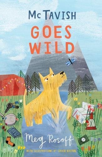 Yellow terrier dog outdoors with mountains, tent, and camping gear.