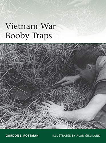 Book cover: soldier searching tall grass, titled "Vietnam War Booby Traps.