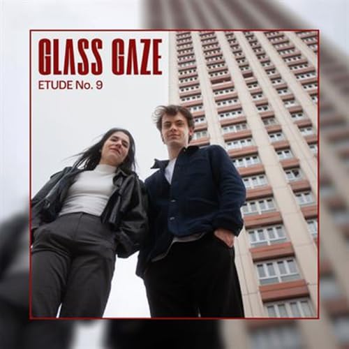 CD cover featuring two people in front of a tall building.