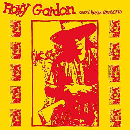 Yellow album cover with a red silhouette of a man playing guitar.