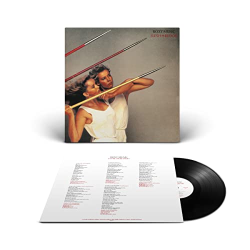 Roxy Music “Flesh and Blood” vinyl record with cover art and lyric sheet.