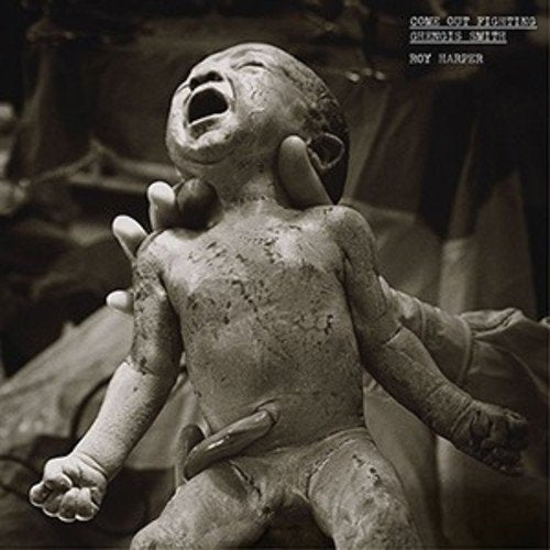 "Black and white vinyl album cover featuring a distressed, clay-like doll with an open mouth."