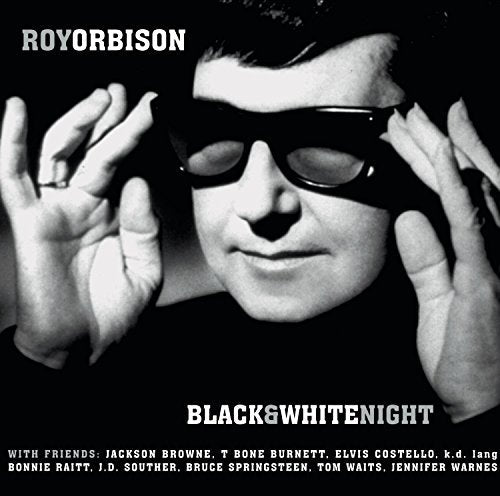 Black and white portrait of Roy Orbison in sunglasses, album cover.