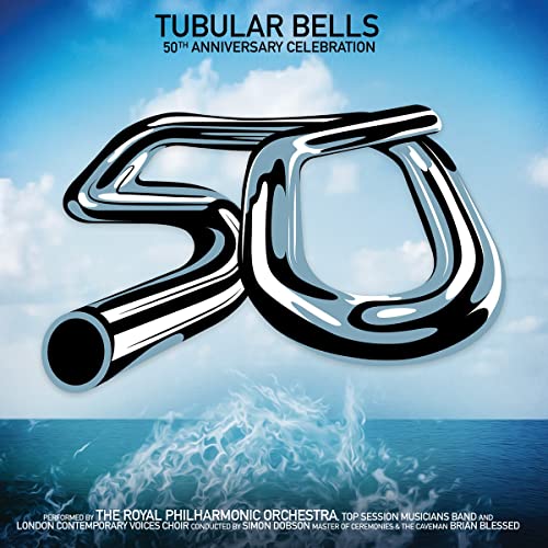 Silver “50” shaped like tubular bells over ocean and sky.