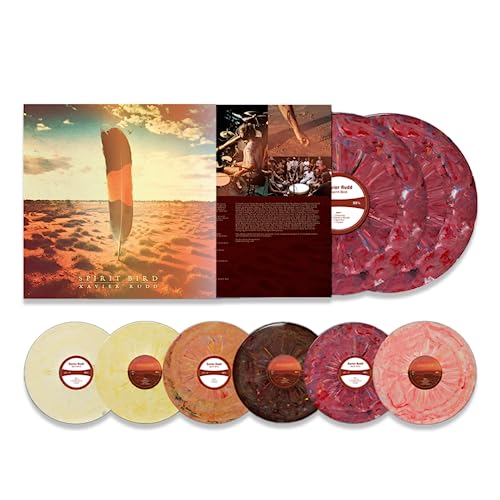 Xavier Rudd’s “Spirit Bird” vinyl album with colorful record discs shown.