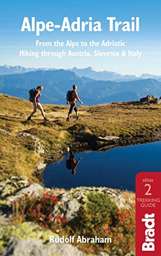 Book cover featuring hikers in a mountainous landscape, "Alpe-Adria Trail.
