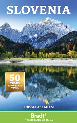 Map or travel guidebook with Slovenia country information and geographical illustrations inside.