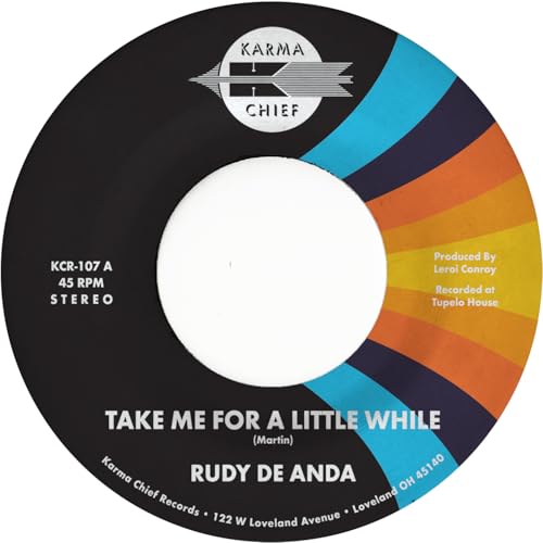 Black vinyl record label with colorful arcs and white center hole.