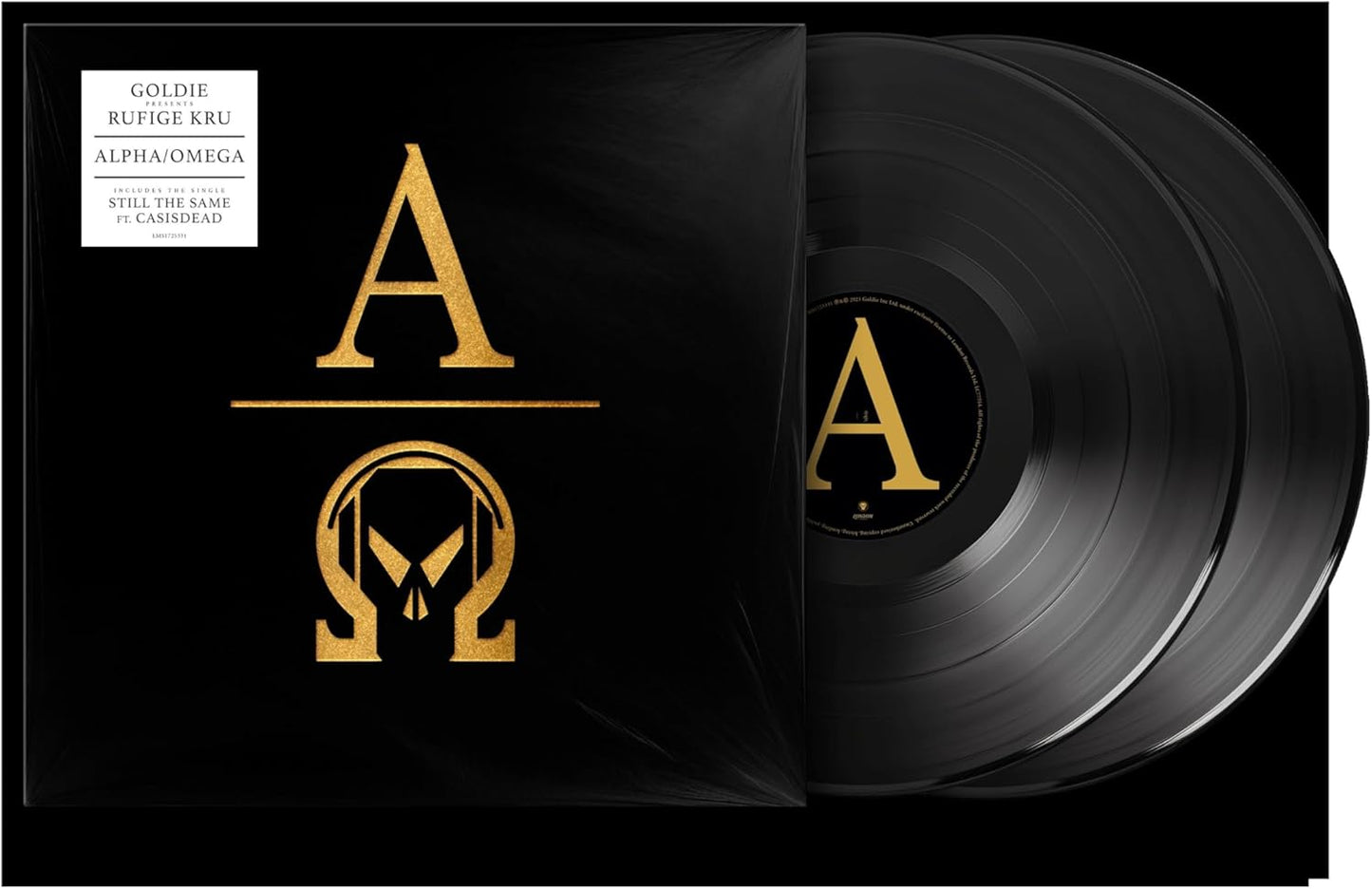 Black vinyl record with gold Alpha/Omega symbol and Goldie’s name.