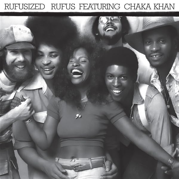 Black and white portrait of the band Rufus featuring Chaka Khan.