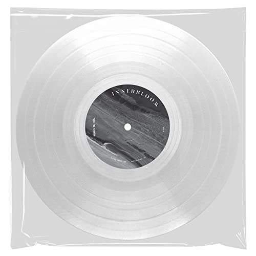 Clear vinyl record in a plastic sleeve with a black and white center label.