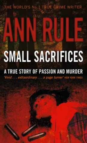 Book cover for Small Sacrifices by Ann Rule featuring a doll on red ground.