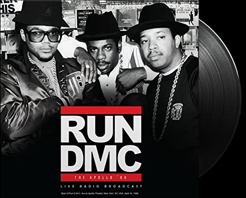 Run-DMC album cover with three men and a vinyl record on the right.