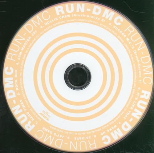 Run-DMC CD with concentric orange and white rings and black text.