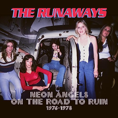 The Runaways band members posing with a vintage car, album cover.