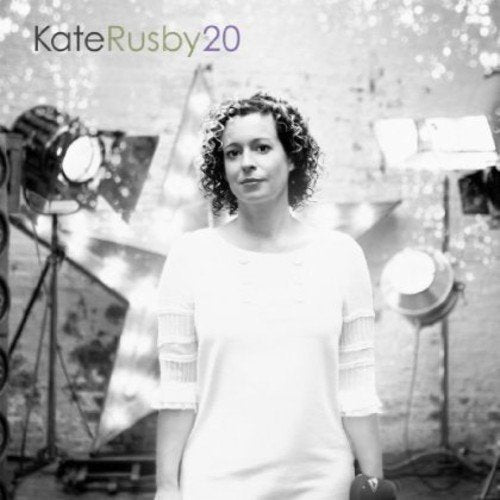 Black and white portrait of Kate Rusby, surrounded by studio lights.