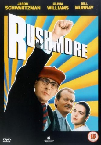 Rushmore DVD cover featuring a boy in a red hat raising a fist.