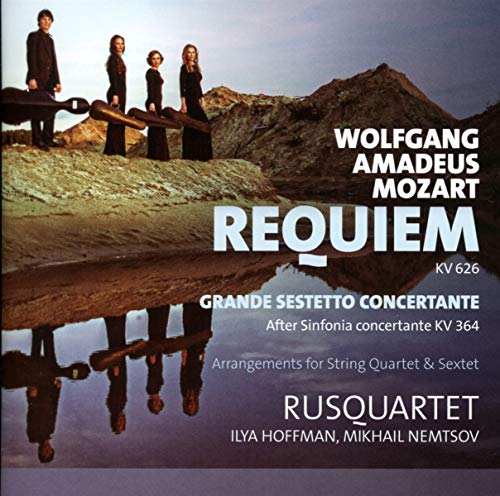CD cover featuring five musicians standing on a rocky lake shore.