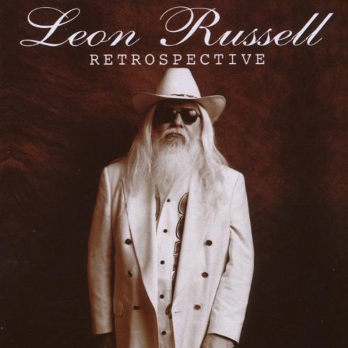 Leon Russell album cover: sepia-toned portrait of musician in white suit.
