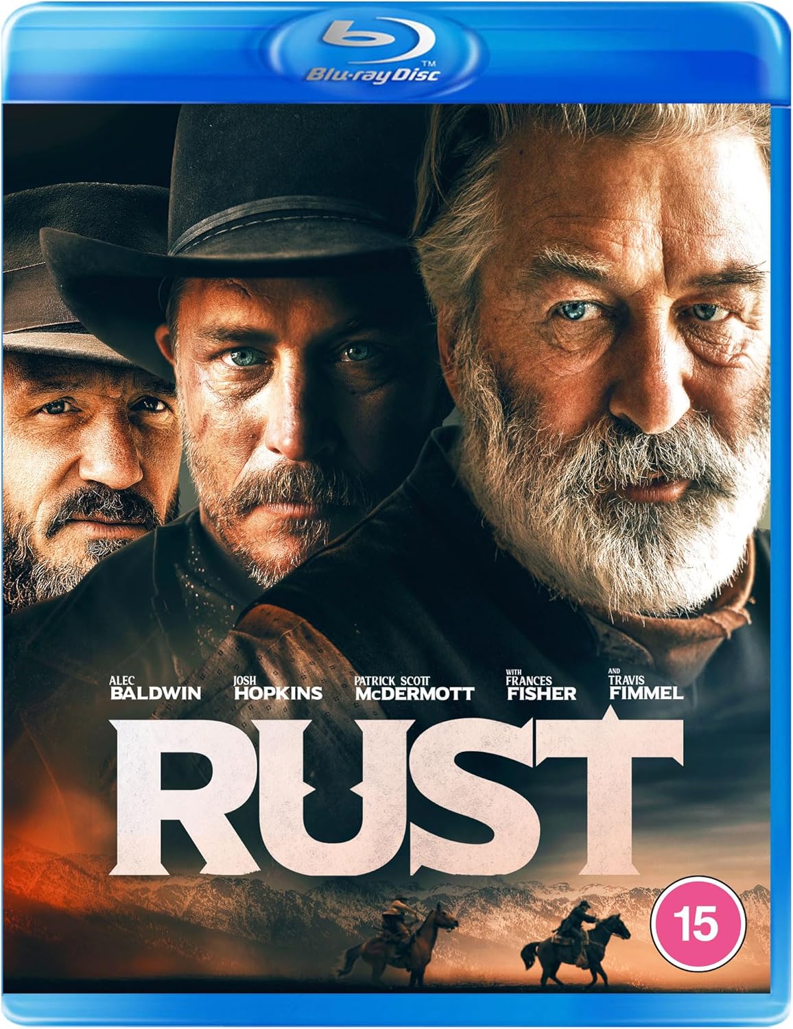 Blu-ray cover for "Rust" featuring Alec Baldwin and Josh Hopkins in Western attire.