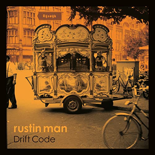Vintage street organ with figures, sepia tone, album cover for Rustin Man.