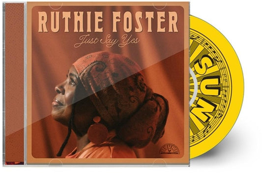 CD case featuring Ruthie Foster's album "Just Say Yes" and a yellow disc.