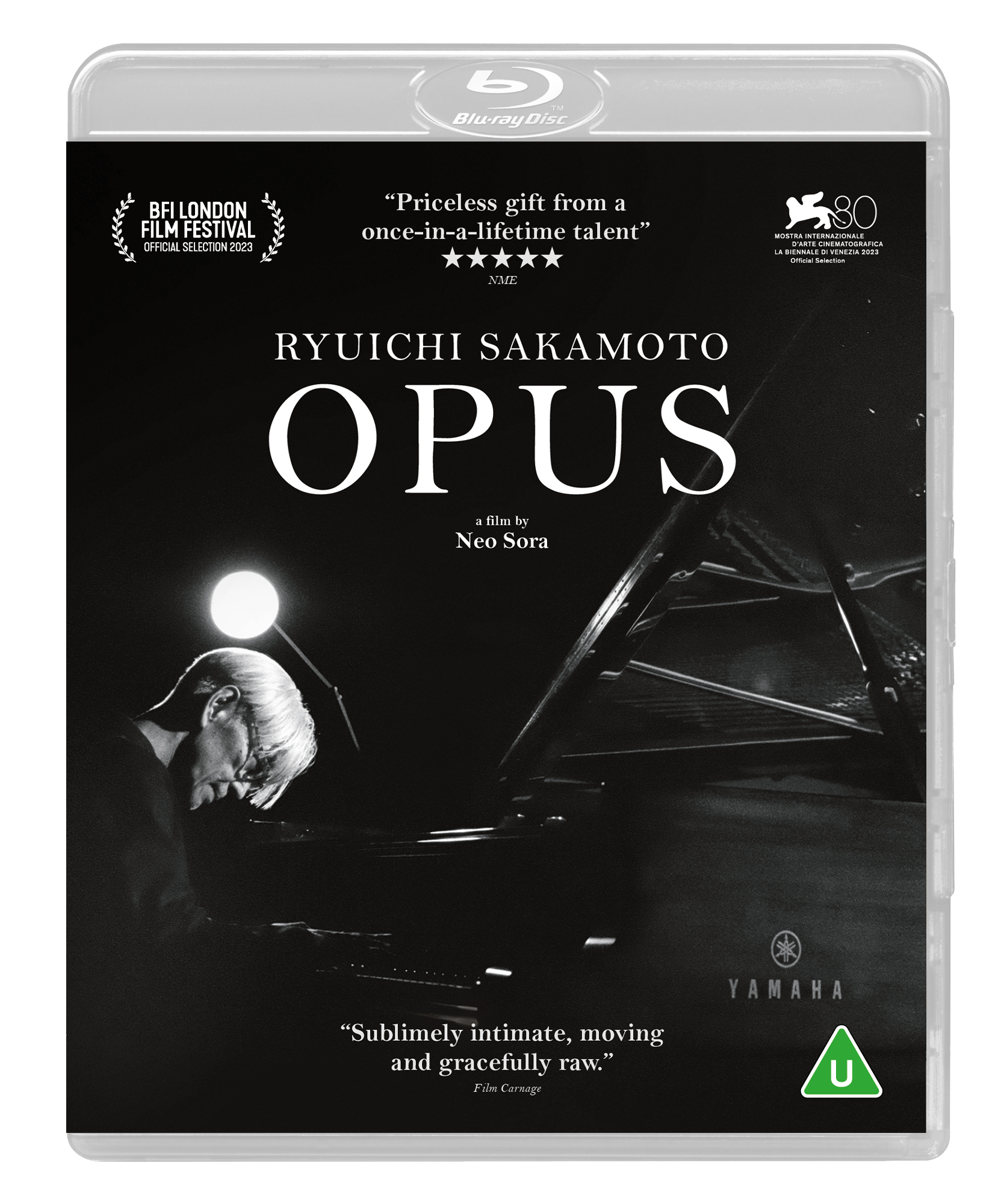 Black and white Blu-ray cover featuring Ryuichi Sakamoto playing a Yamaha grand piano.