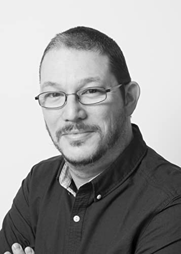 Black and white portrait of a man with short hair and glasses.